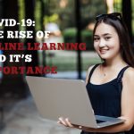 Image of a student with a laptop open