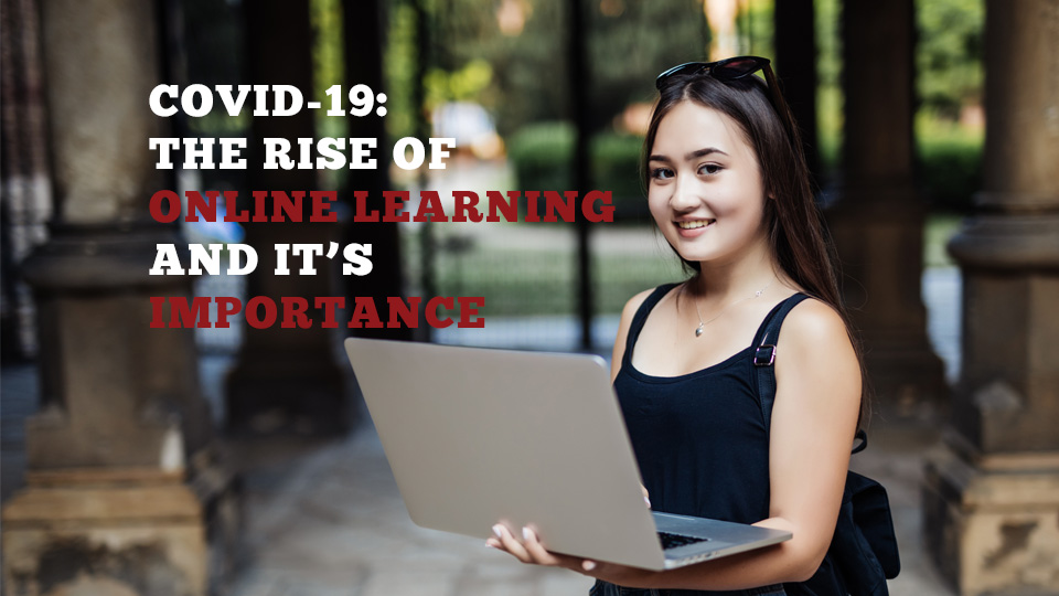 Image of a student with a laptop open